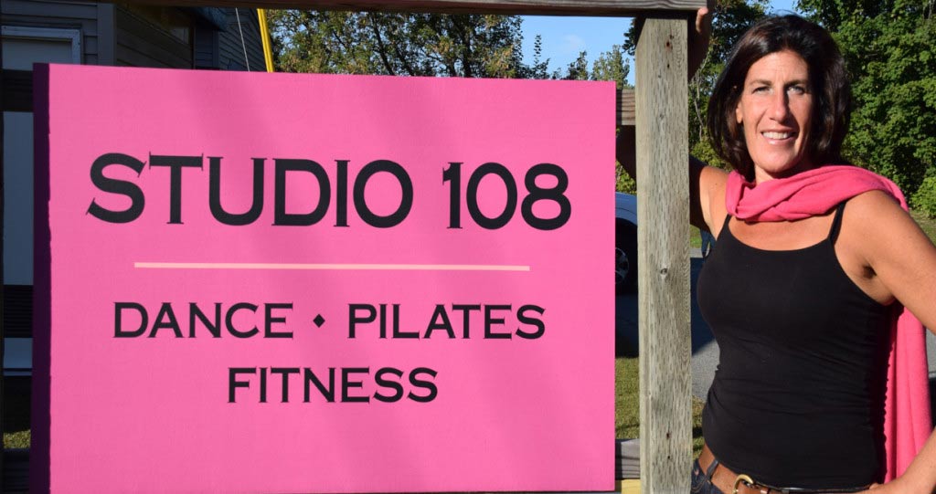 Studio 108 sign and owner